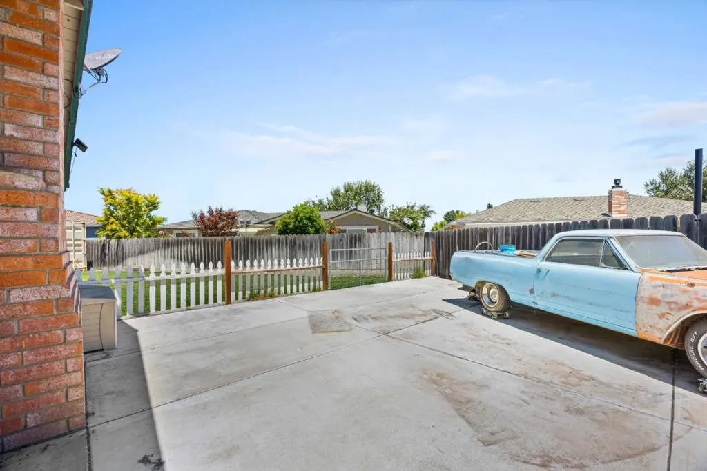 large concrete pad adds incredible versatility for hobbies, recreation, future RV parking potential