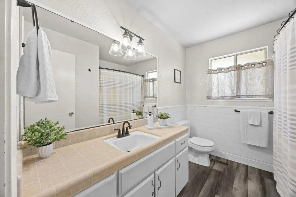 guest hall bath features shower over tub and ample storage
