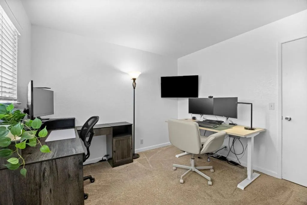 This flexible room is currently serving as a bright home office