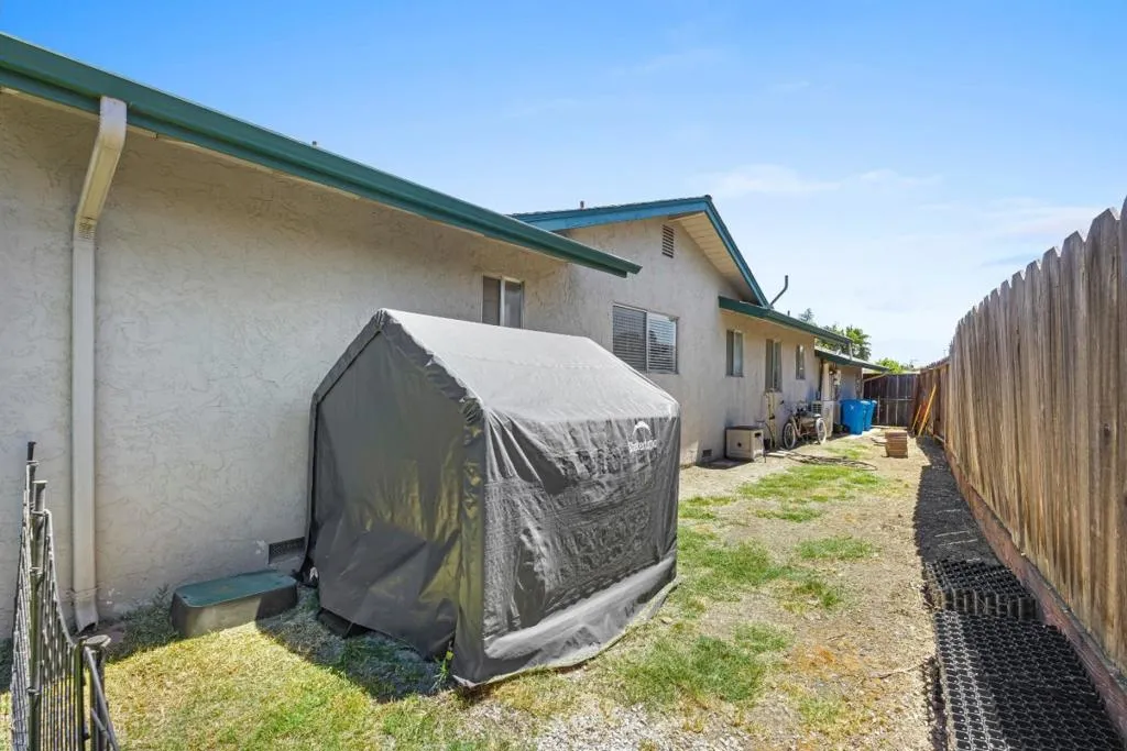 Spacious side yard serves as dog run, private & accessible from back yard, front gate or garage door