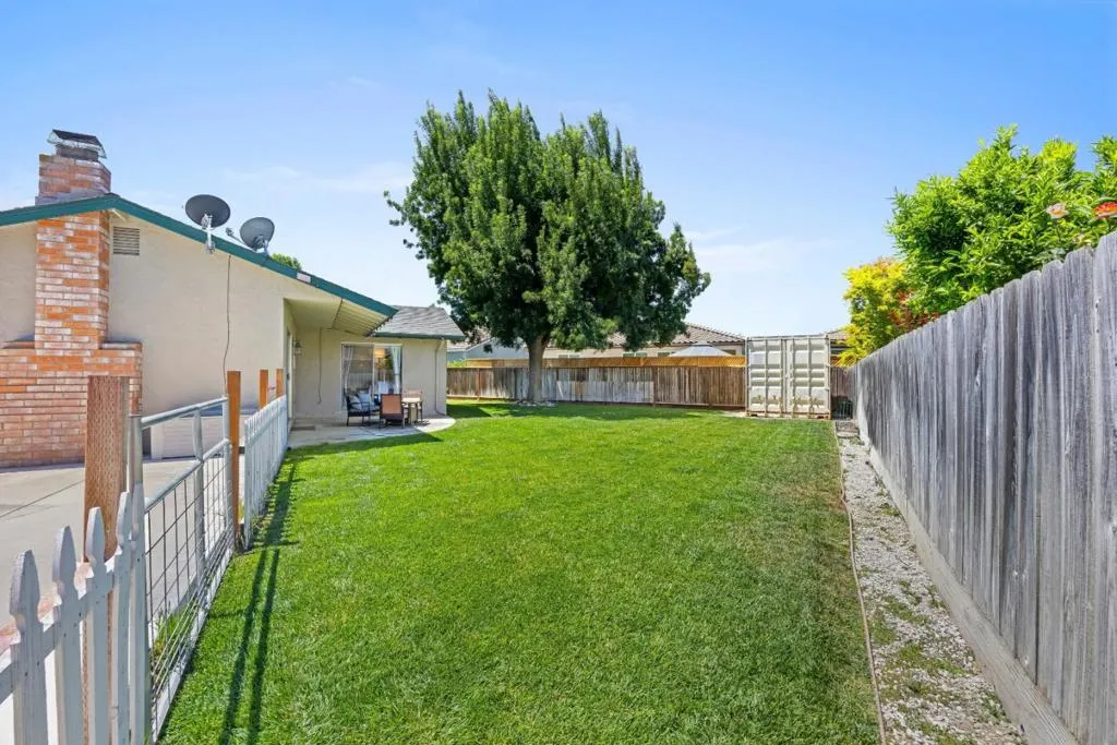 The generous pie-shaped lot provides exceptional usable space rarely found in comparable homes.