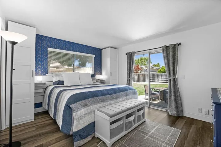 generously sized primary suite w backyard access, abundant natural light w room for a king size bed