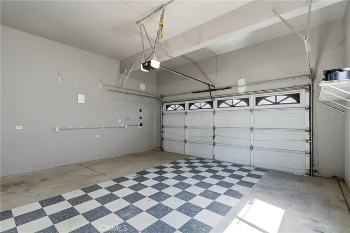 Spacious 2-car garage with laundry hookups and entry into lower level.