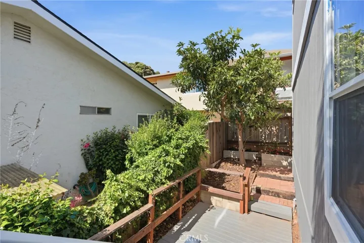 Back patio accessed by bedroom 3 as well as by both side yards.