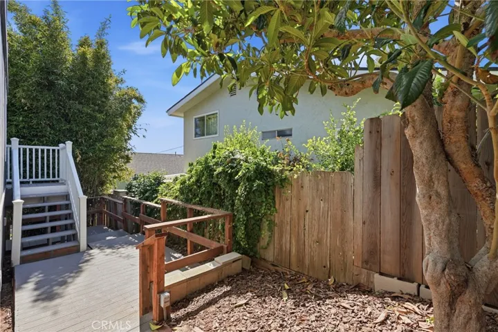 Back patio accessed by bedroom 3 as well as by both side yards.