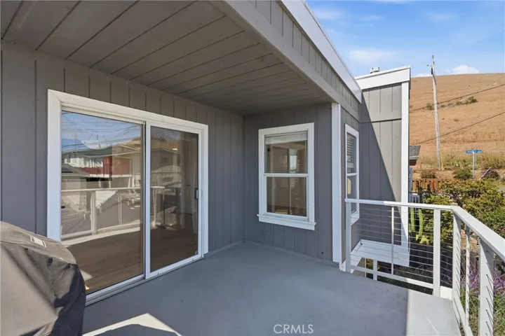 Front Patio off of dining room with views of ocean to the west, Morro Rock to the south, and the hills to the east