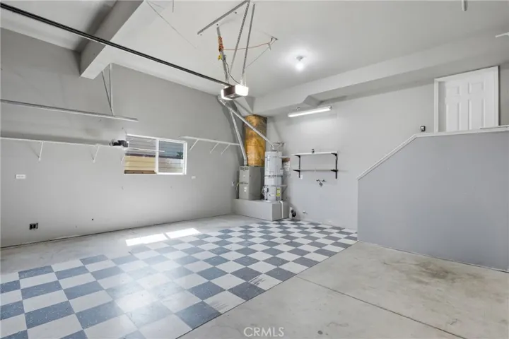 Spacious 2-car garage with laundry hookups and entry into lower level.