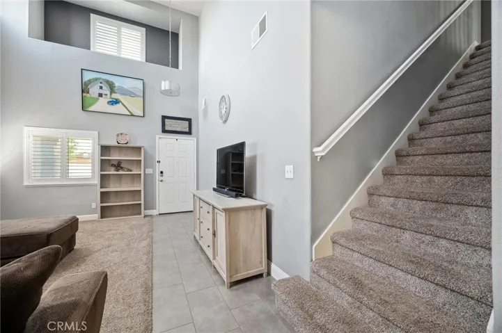 Staircase leading to all upper-level bedrooms.