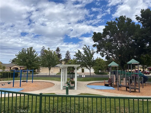 Beautifully maintained children's play area with plenty of space for activities.