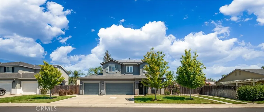 This photo showcases a well-maintained front yard, highlighting the property's curb appeal and landscaping.