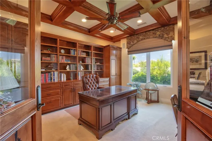 Office with bult ins and coffered ceiling