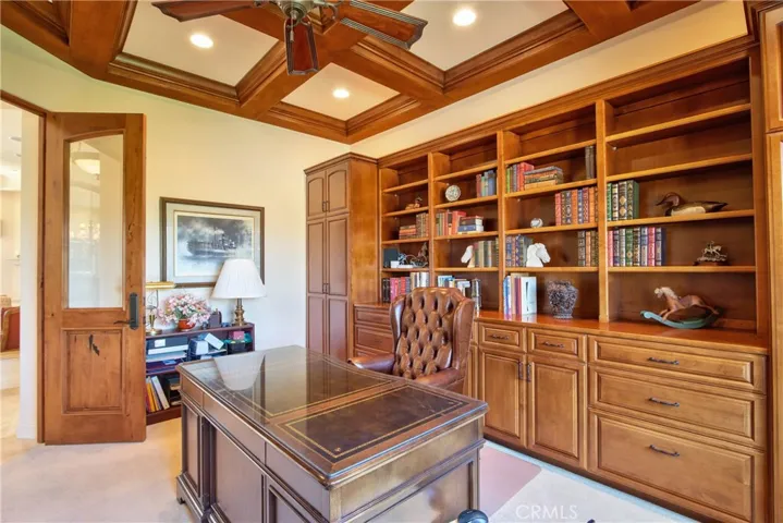 Office with bult ins and coffered ceiling