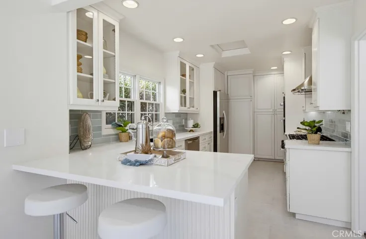 Gorgeous countertops with depth at the end for eat-in seating