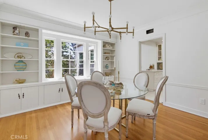 Formal dining room with a view to built-ins