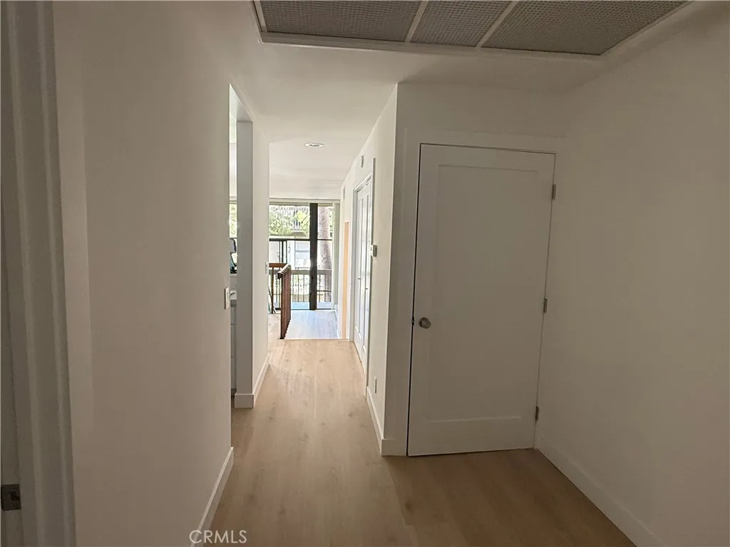 View from main door entry into home and coat and storage closet.
