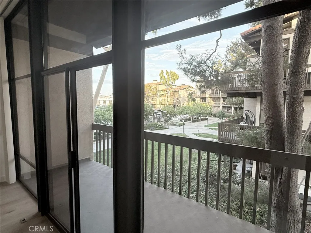 Peekabo view of private entry bridge to Marina Pacifica Shopping Center.