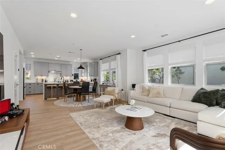 Designed for modern living, the expansive great room showcases newly installed luxury vinyl plank flooring and thoughtful custom upgrades that set this home apart from the builder's original design.