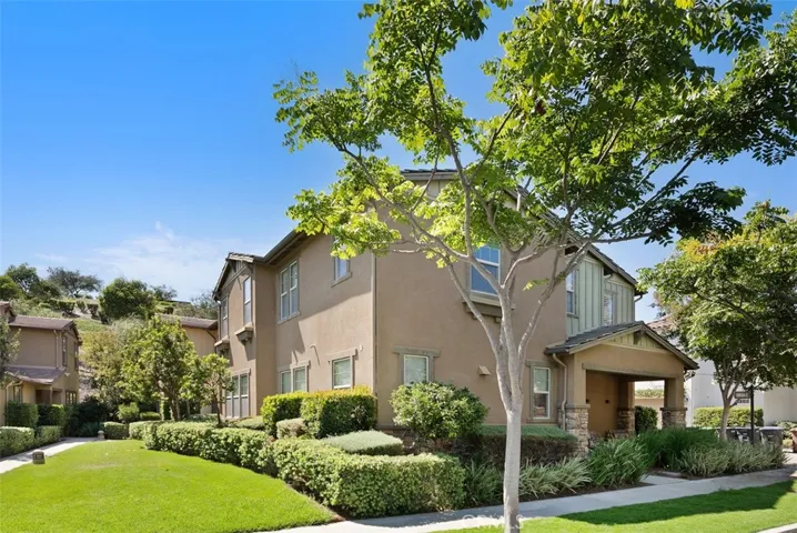 (Unaltered photo of exterior of home) Modern Craftsman architecture complemented by professionally landscaped grounds, a welcoming covered porch, and exceptional curb appeal.