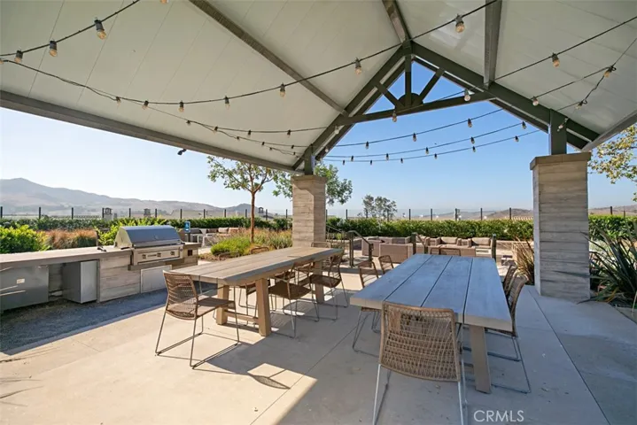 Enjoy resort-style living with covered outdoor dining, built-in BBQs, and gathering spaces designed for effortless entertaining with family and friends.