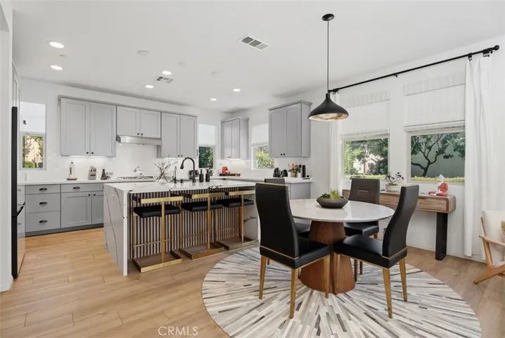 The open-concept design creates a seamless connection between the kitchen, dining area, and great room. Perfect for entertaining and everyday living.
