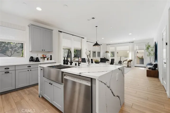 A thoughtful redesign transformed the original coat closet into a spacious walk-in pantry, providing exceptional storage and organization rarely found in homes of this size.