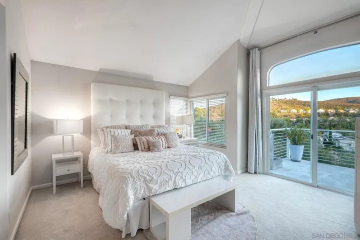 Primary bedroom features a large balcony to enjoy the often stunning sunrise and sunset views.