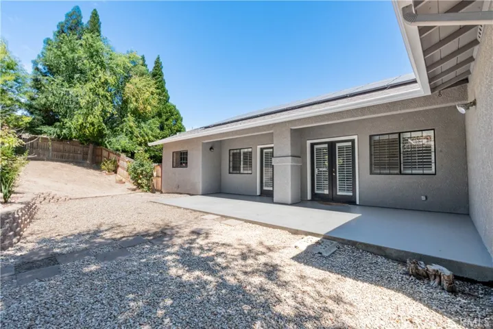 Large patio with 2 access doors to the inside
