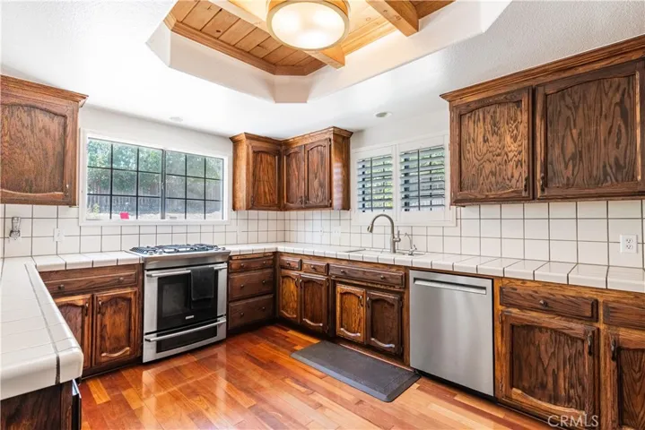 The kitchen with stainless appliances has plenty of countertop space
