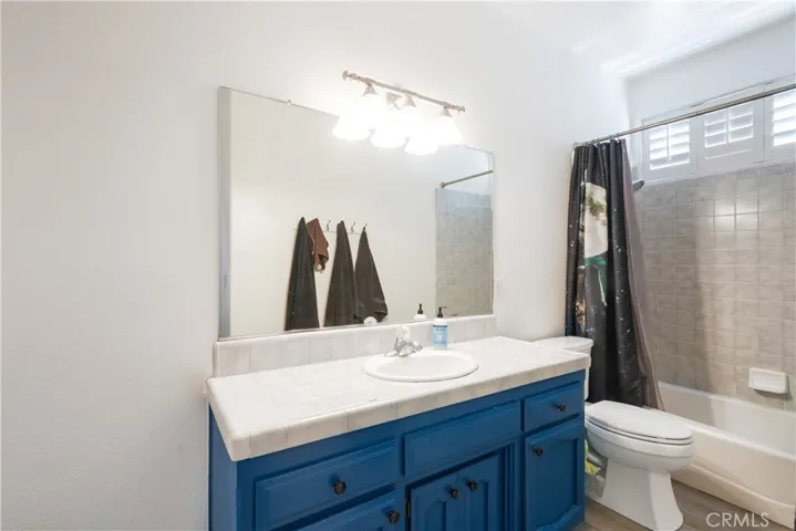 Hall bathroom with this vanity plus a large cabinet to the left