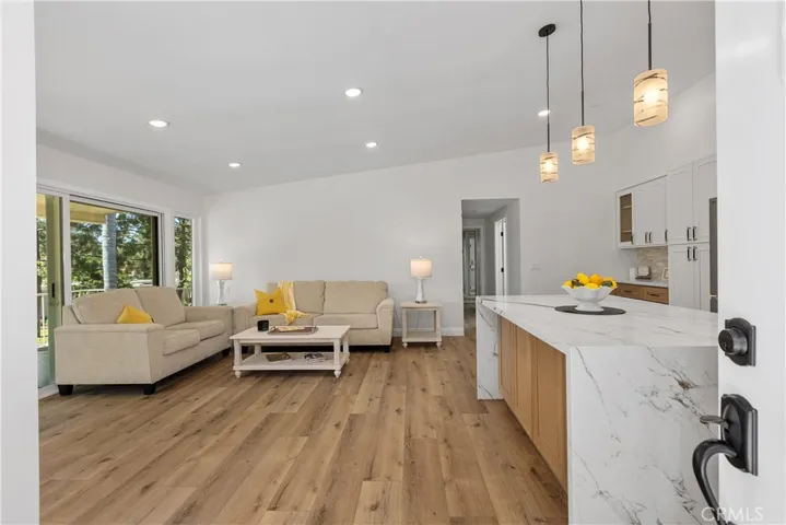 Watefall quartz island with storage and room for barstool seating