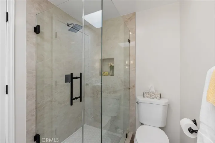 Guest bathroom with glass enclosed shower
