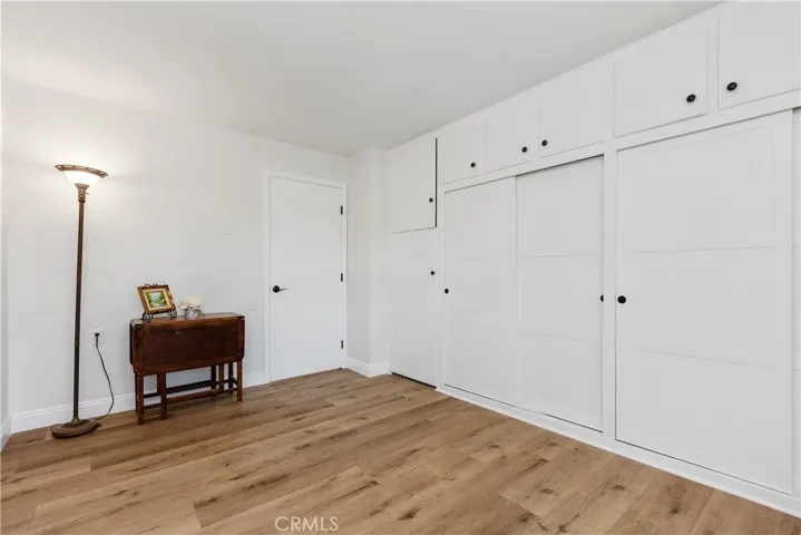 Guest bedroom with a wall of closet