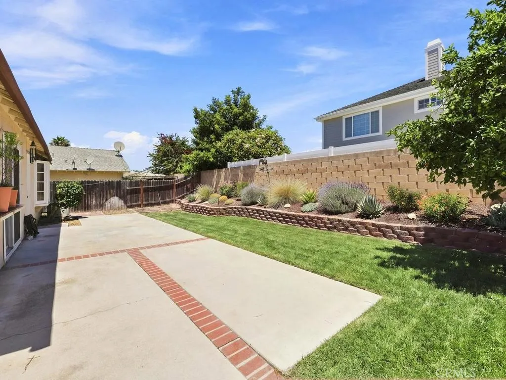 Nice size back yard with Virtually staged grass & plants