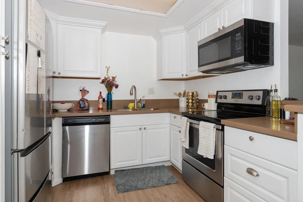This kitchen is updated with newer applicances and counter tops.