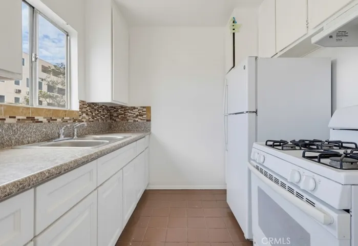 Unit 4 - Kitchen with Natural Light, Stove & Refrigerator