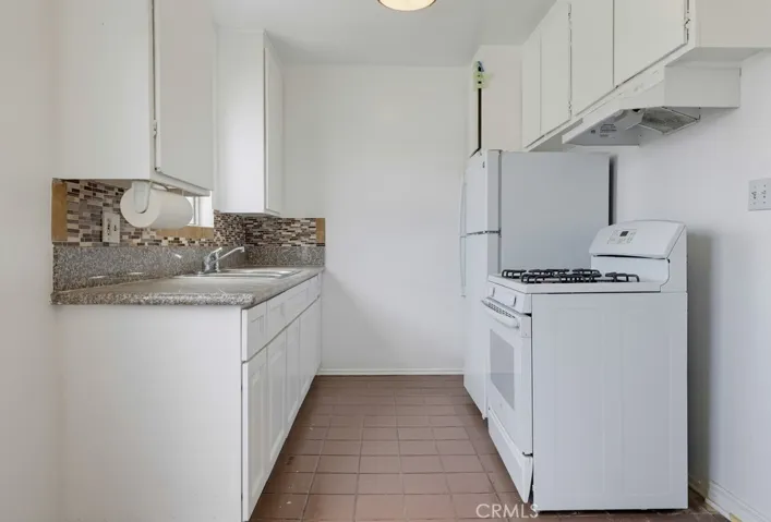 Unit 4 - Kitchen with Newer Countertop and Upper & Lower Cabinets