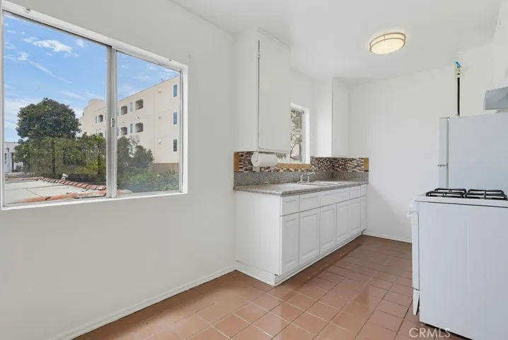 Unit 4 - Kitchen with Natural Light, Stove & Refrigerator