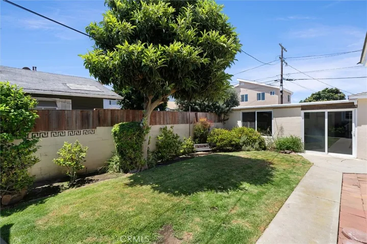 LOOKING FRONT HOUSE ACROSS BACKYARD