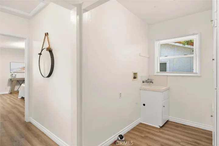 SPACIOUS LAUNDRY ROOM WITH PANTRY AND STORAGE SPACE