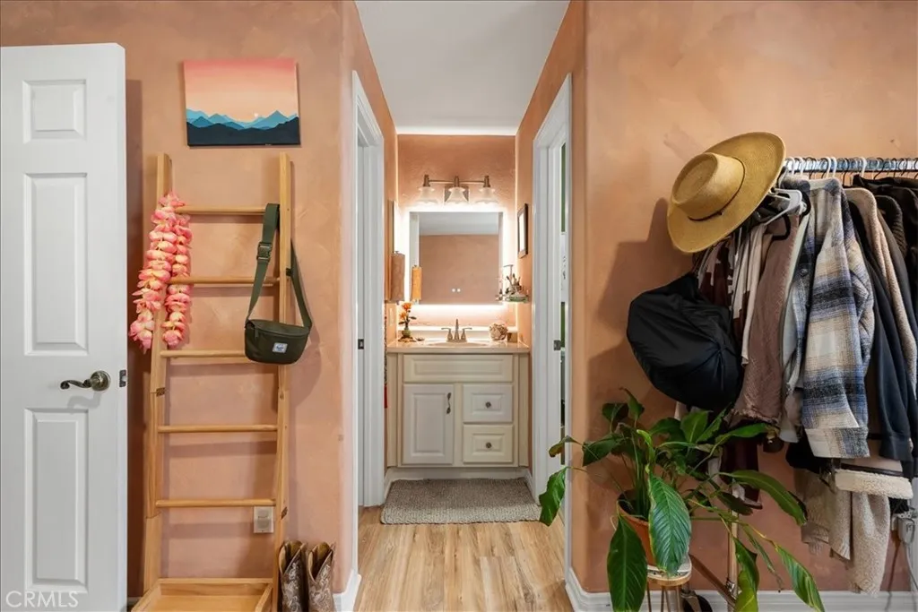 closet door to your left, primary restroom door to your right inside the primary room