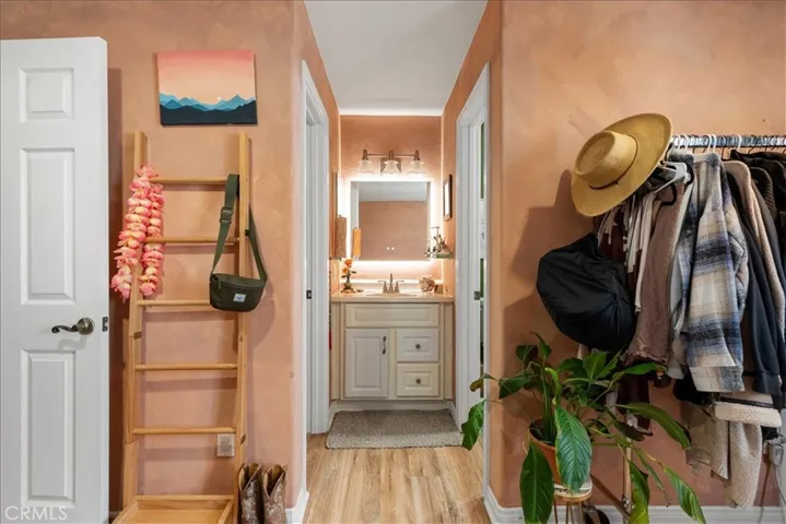 closet door to your left, primary restroom door to your right inside the primary room