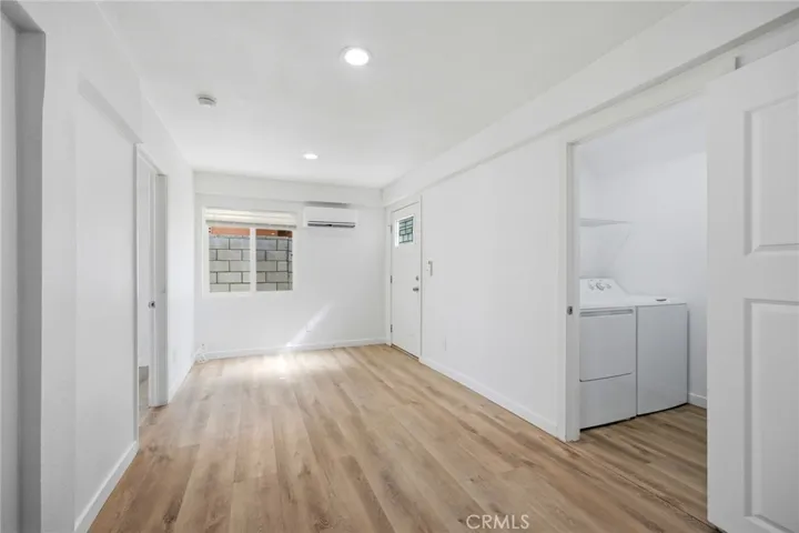 Unit #3: 2 Bd/1 Bath Living Room & Private Laundry Room