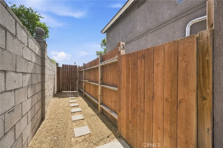Walkway to Main Unit Backyard From Street Through Gate.
