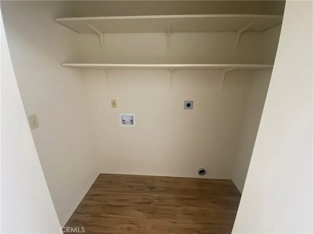 Laundry area in hall closet.