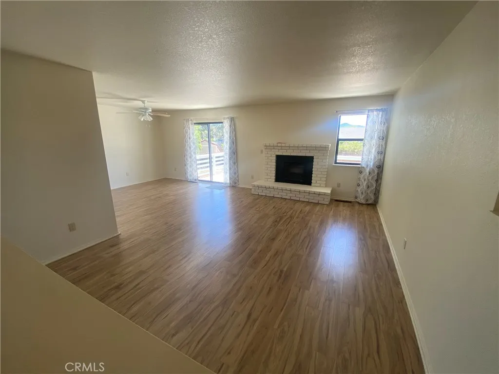 Living area has brick fireplace.