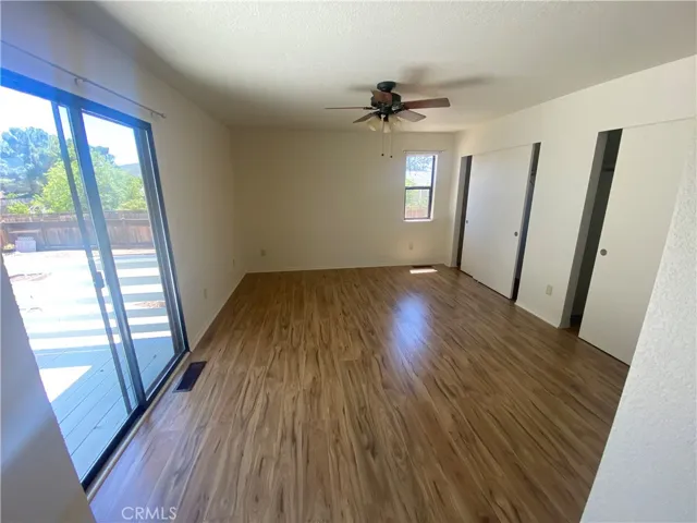 Primary bedroom has slider to back deck.