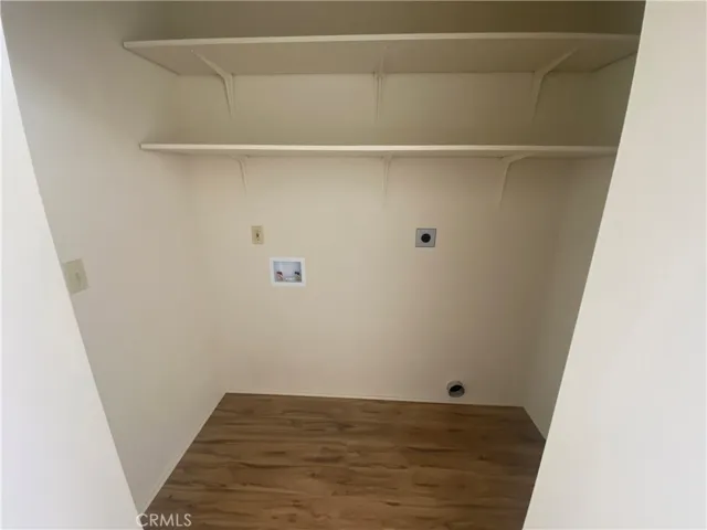 Laundry area in hall closet.