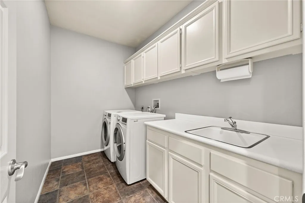 Laundry room with extra storage and sink
