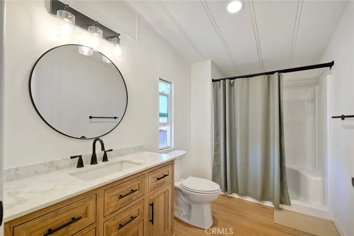 PRIMARY BATHROOM HAS WALK IN SHOWER W/SEAT.