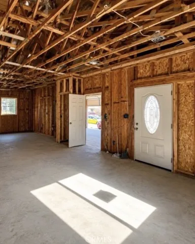 Open Kitchen & Living Area Showing Attached Garage Access